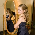 Junior bridesmaid in mirror.