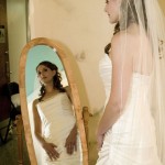 Bride in mirror.