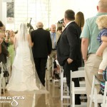 Bride and father from the back walking down the aisle.