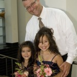 Two of the junior bridesmaids with their dad.