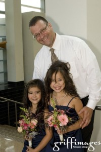 Two of the junior bridesmaids with their dad.